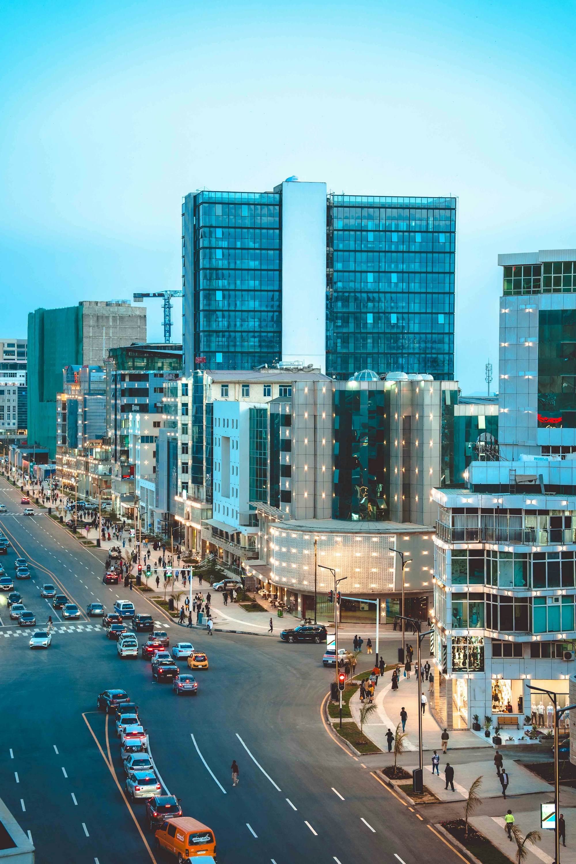 Modern Bole Medhanialem corridor and city streets in Addis Ababa at dusk